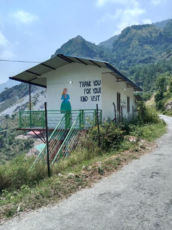 a sign on the side of a building at Corn Village Cottage in Lakhwār