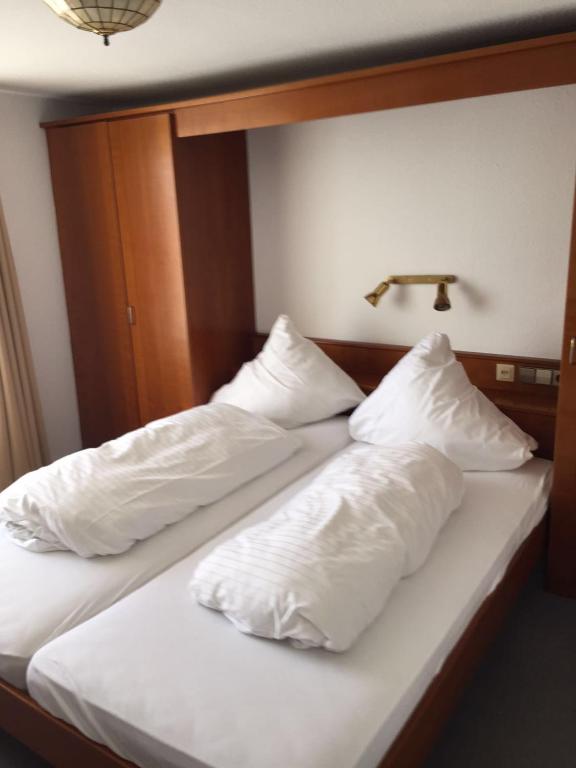 Postel nebo postele na pokoji v ubytování Hotel Strandcafé Dischinger