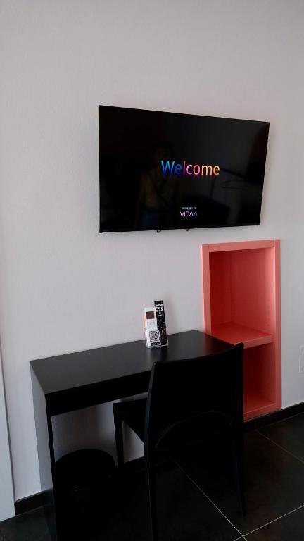 TV a/nebo společenská místnost v ubytování Indaco