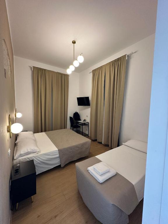 Postel nebo postele na pokoji v ubytování Hotel Lodi