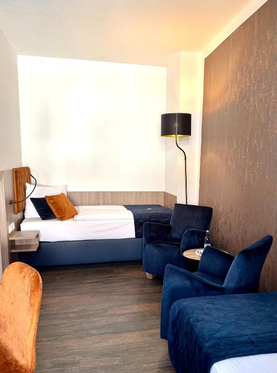 Postel nebo postele na pokoji v ubytování Hotel Am Dom