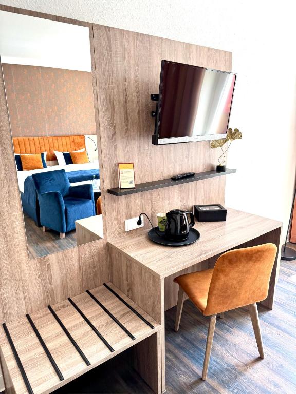 TV a/nebo společenská místnost v ubytování Hotel Am Dom