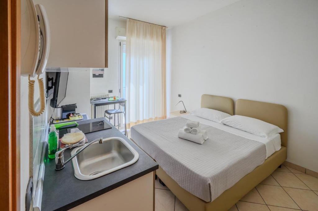 Posteľ alebo postele v izbe v ubytovaní Residence l'Appartamento