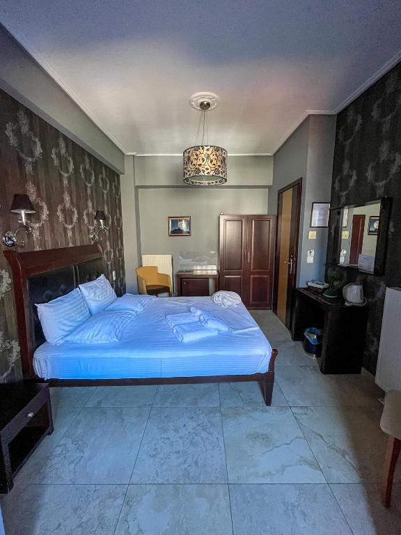Postel nebo postele na pokoji v ubytování Toti Boutique Rooms