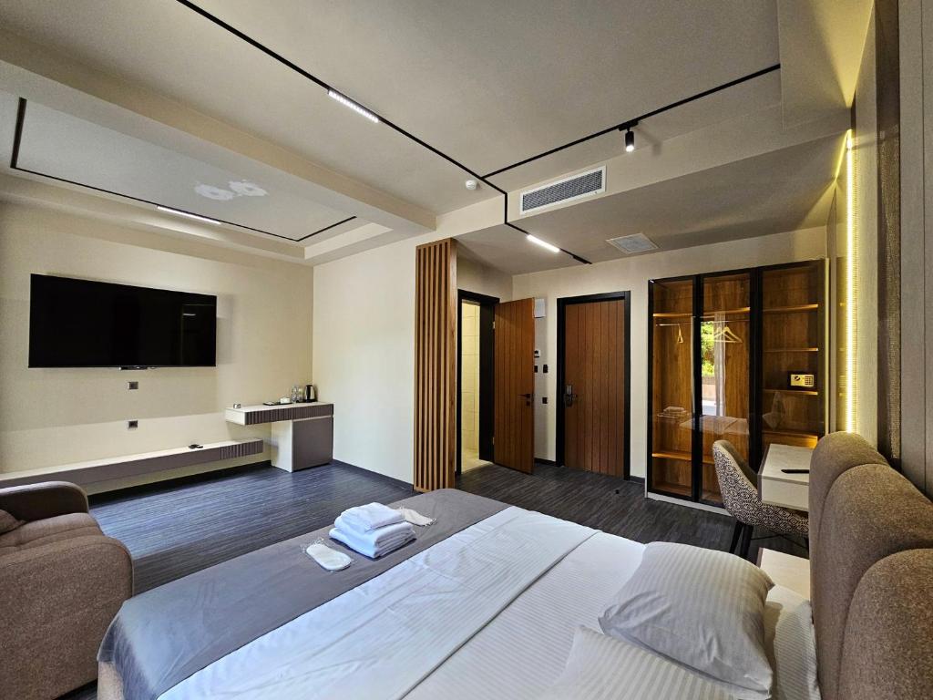 Postel nebo postele na pokoji v ubytování Tskaltubo Epic Hotel & Spa
