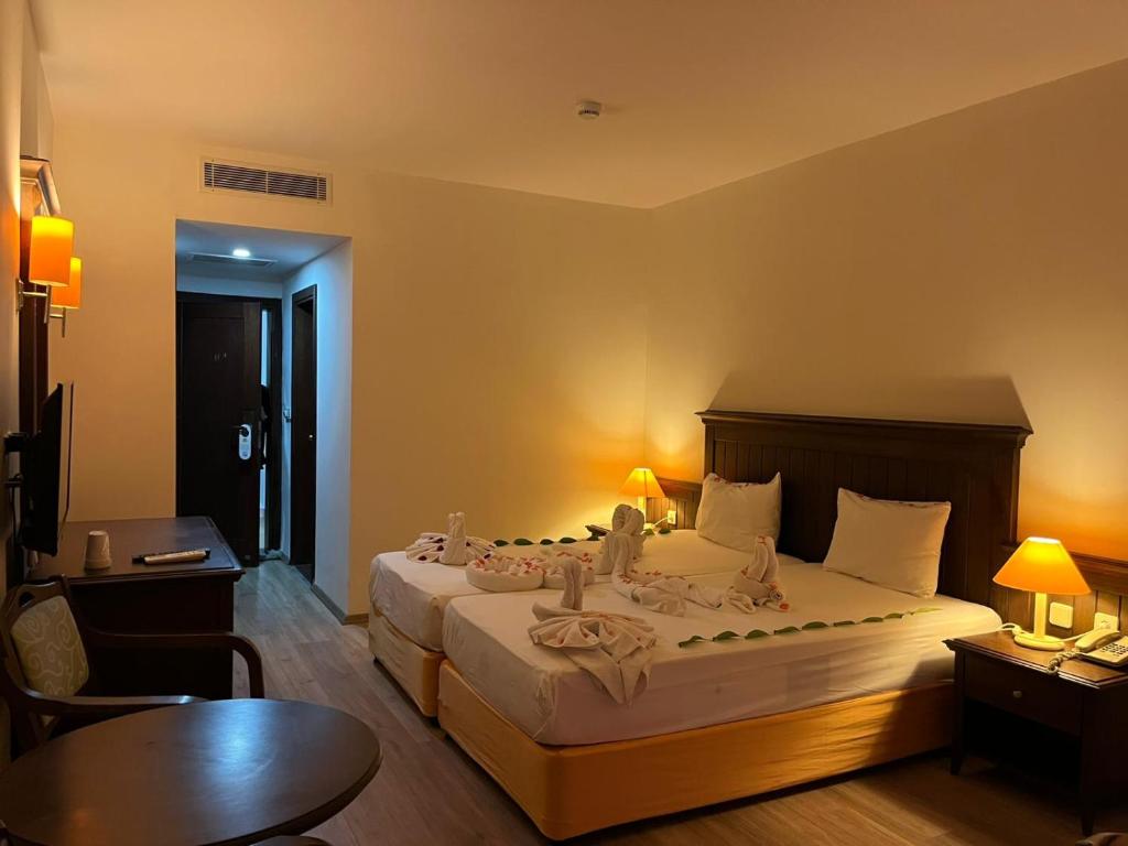 Postel nebo postele na pokoji v ubytování Side Palm D'or Hotel