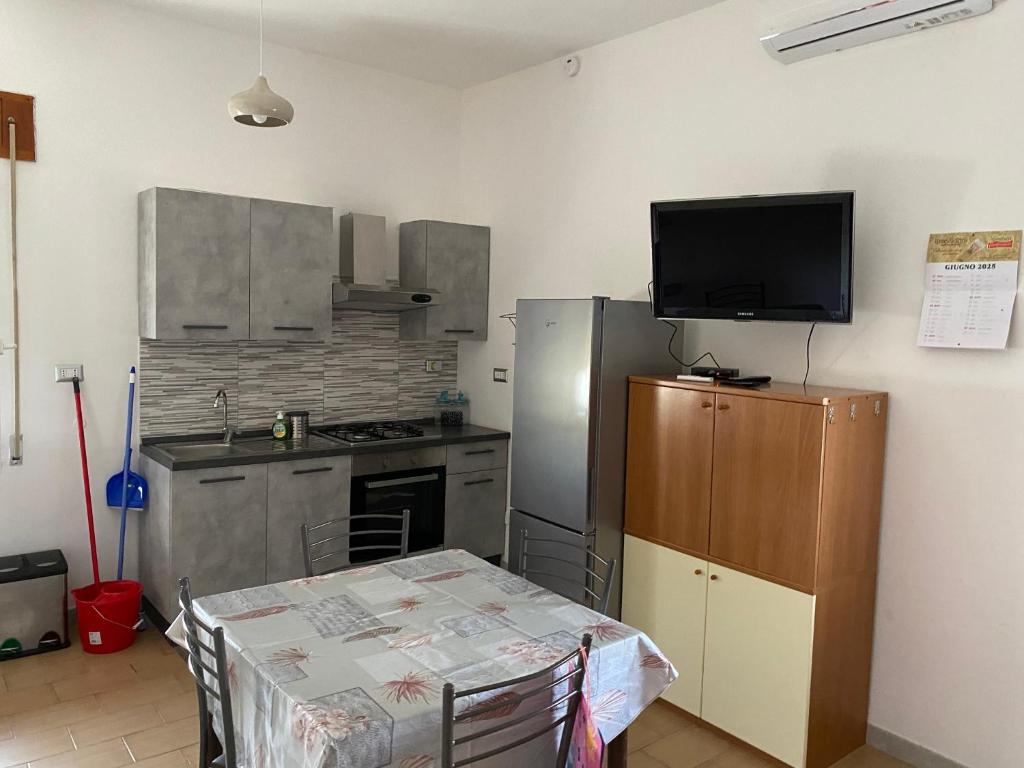 Kuchyň nebo kuchyňský kout v ubytování Residenza Rogiò
