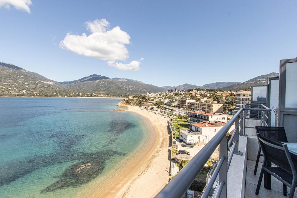 a view of the beach from the balcony of a resort at U Scaldasoli in Propriano