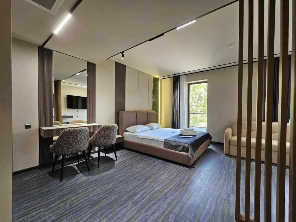 Postel nebo postele na pokoji v ubytování Tskaltubo Epic Hotel & Spa