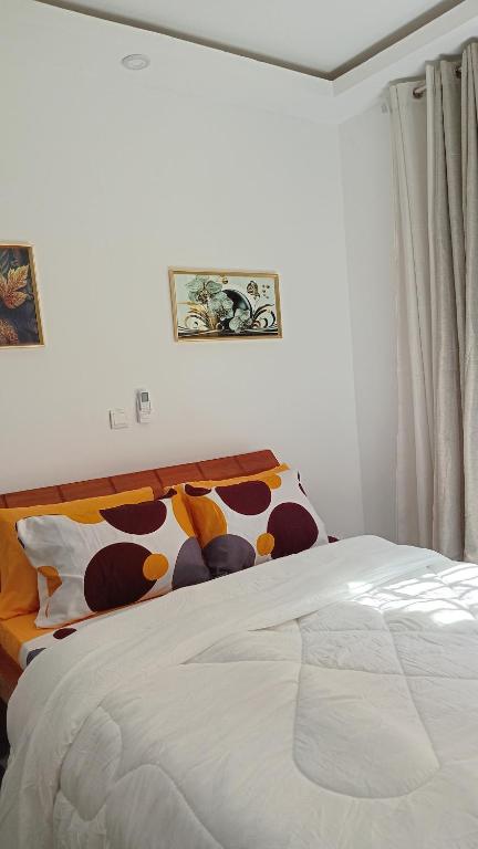 เตียงในห้องที่ Résidence Saphyr