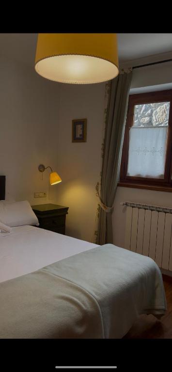 Postel nebo postele na pokoji v ubytování Hotel Colomers