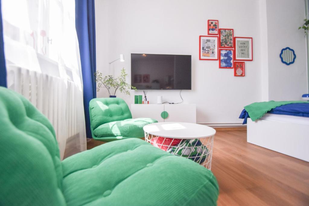 TV a/nebo společenská místnost v ubytování Apartmány v centru Olomouce