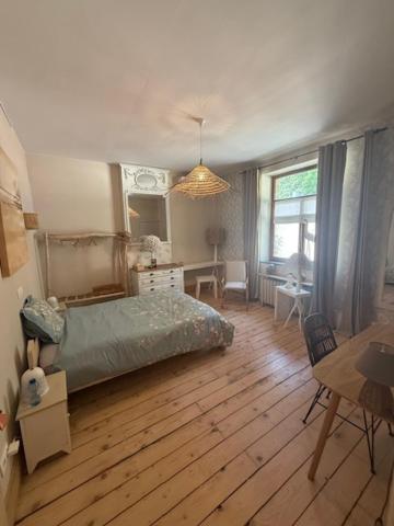 Postel nebo postele na pokoji v ubytování Le Jardin Des Secrets "Gites et chambres à louer"