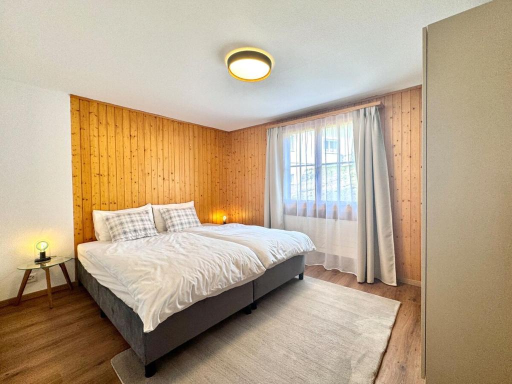 Postel nebo postele na pokoji v ubytování Chalet Gemsblick