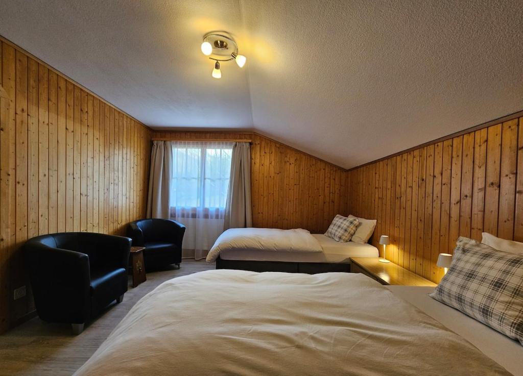 Postel nebo postele na pokoji v ubytování Chalet Gemsblick