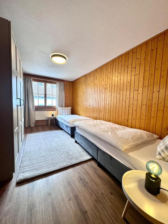 Postel nebo postele na pokoji v ubytování Chalet Gemsblick