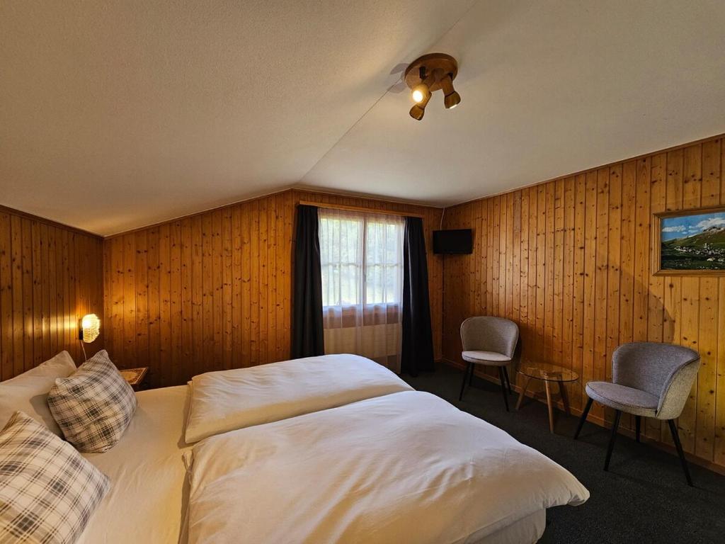 Postel nebo postele na pokoji v ubytování Chalet Gemsblick