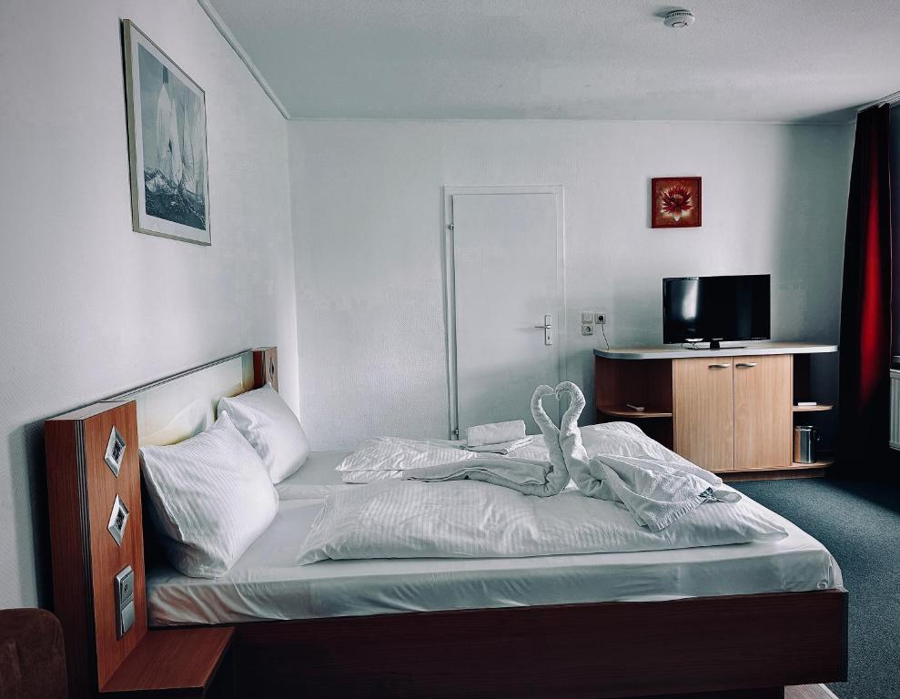Postel nebo postele na pokoji v ubytování Hotel Granitz