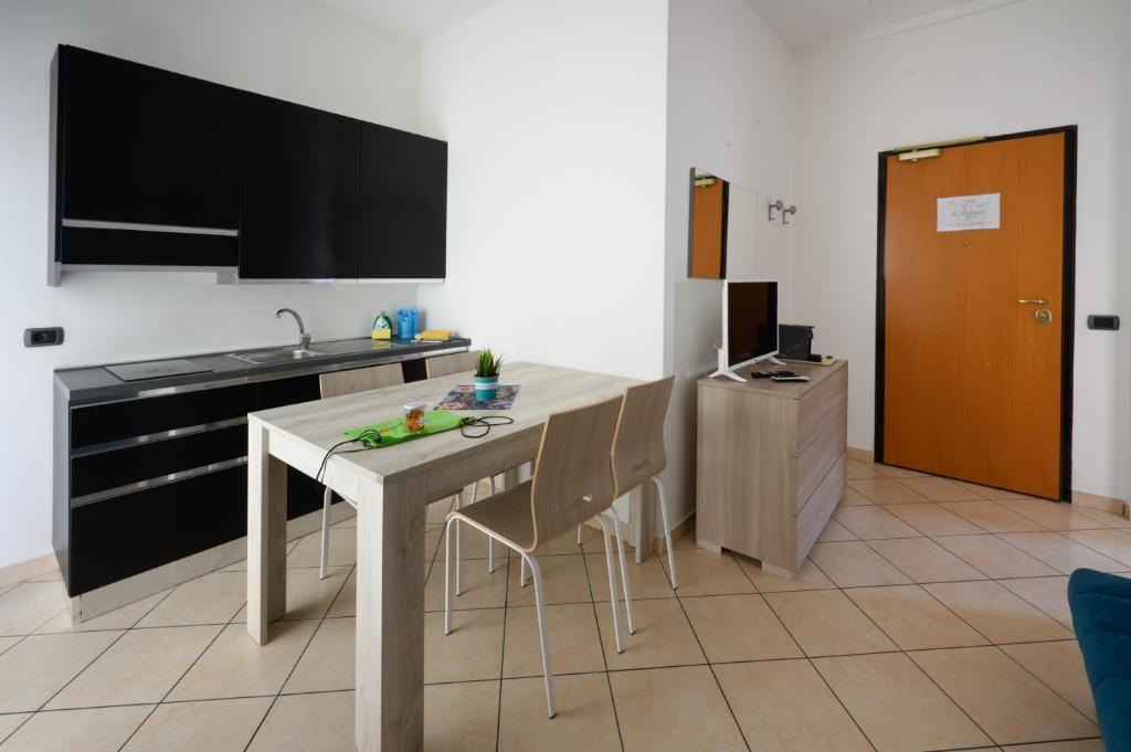 Televízia a/alebo spoločenská miestnosť v ubytovaní Residence l'Appartamento
