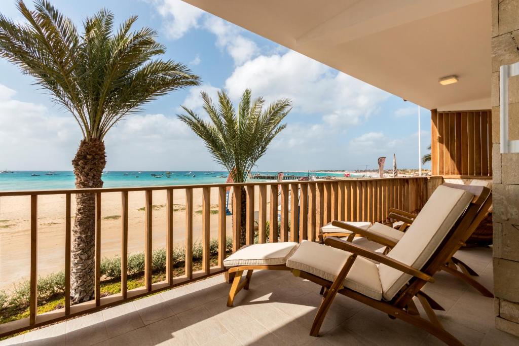 a balcony with a view of the beach at Villa ao Mar in Santa Maria