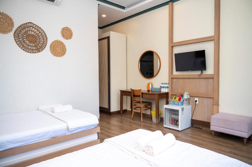 Giường trong phòng chung tại Gia An Hung Guest House