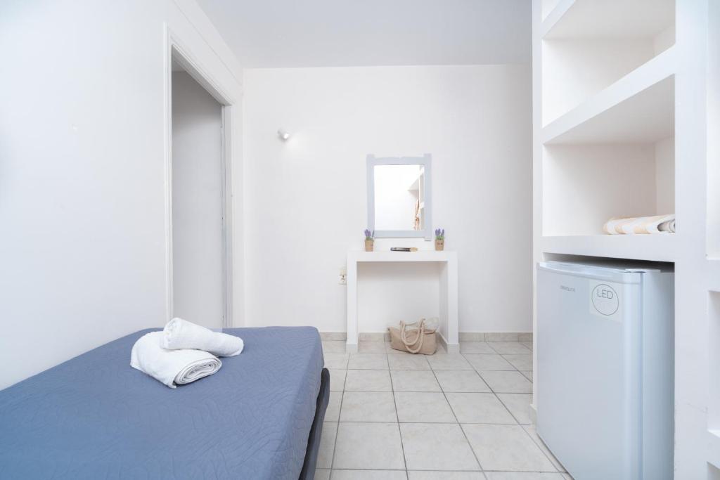 Postel nebo postele na pokoji v ubytování Blue Palm Hotel