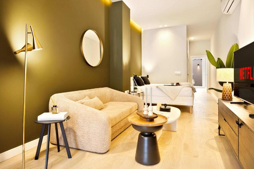 a living room with a couch and a table at SariStays Valencia City Center L in Valencia