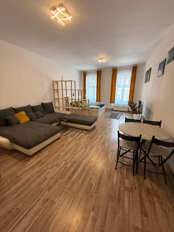 a living room with a couch and a table at Vadim's guesthouse in Sibiu