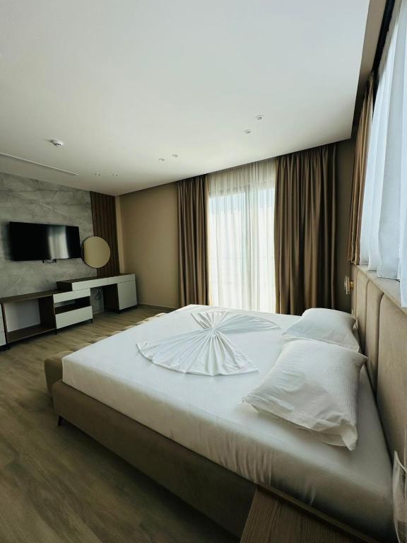 Postel nebo postele na pokoji v ubytování Hotel Roalb