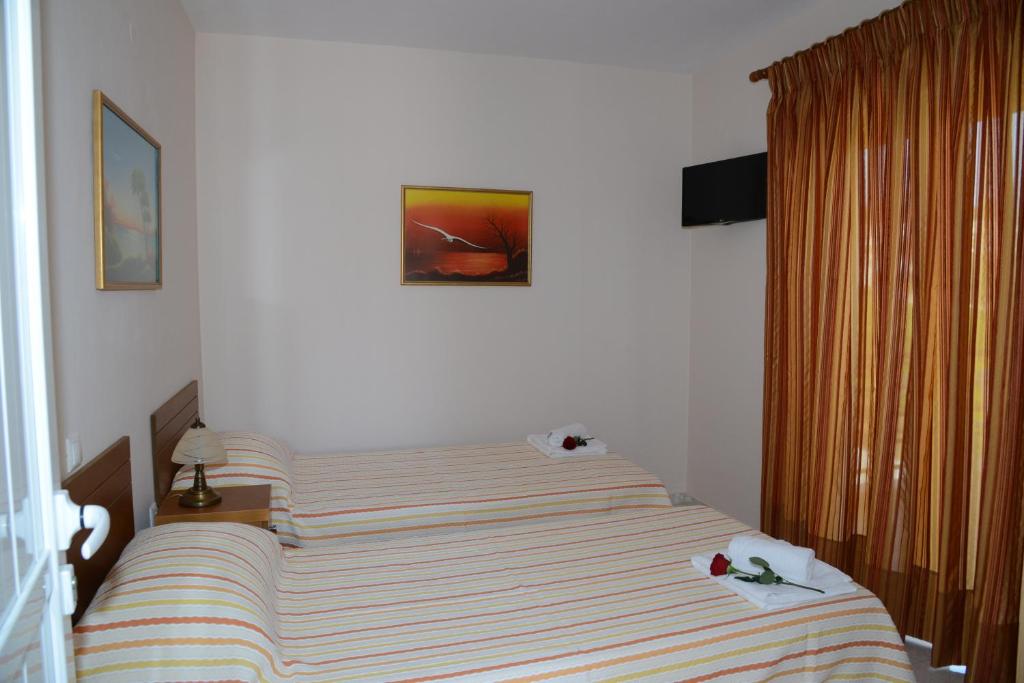 Posteľ alebo postele v izbe v ubytovaní Maria's Filoxenia Suites