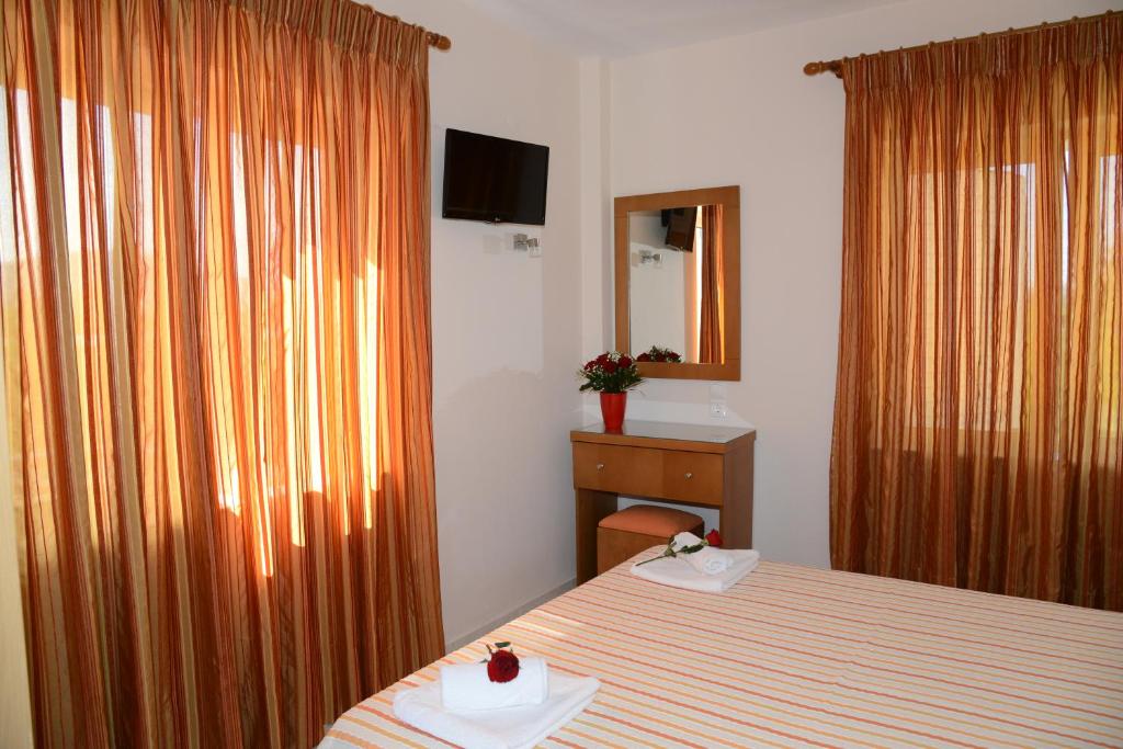Posteľ alebo postele v izbe v ubytovaní Maria's Filoxenia Suites