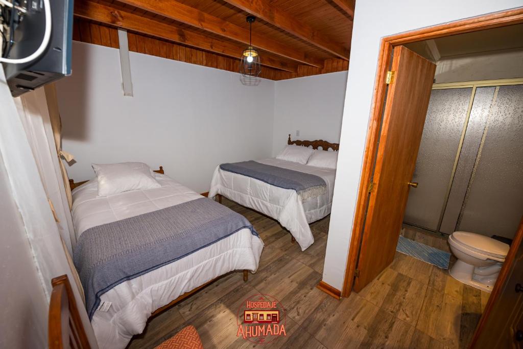 Una cama o camas en una habitación de Hospedaje Ahumada