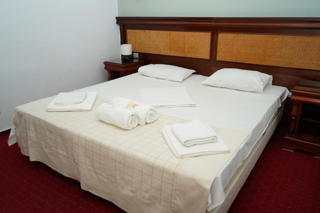 Postel nebo postele na pokoji v ubytování Hotel Bliss