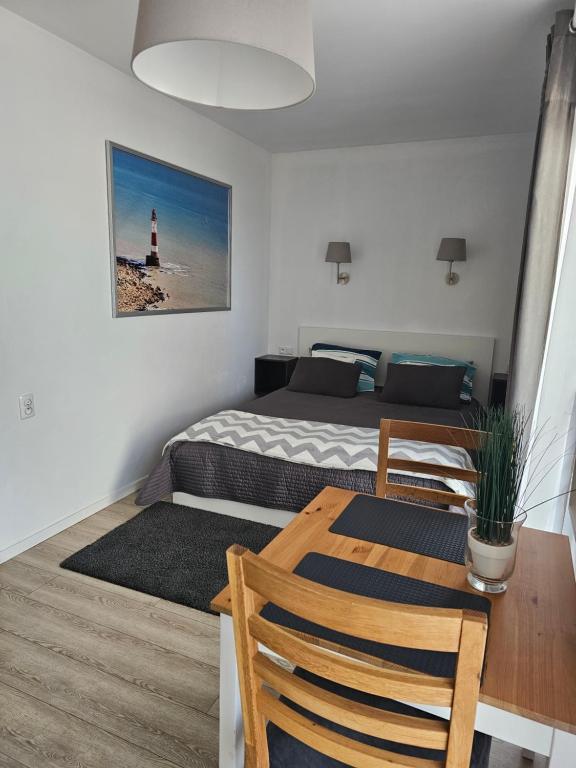 Łóżko lub łóżka w pokoju w obiekcie Dom Przy Plaży