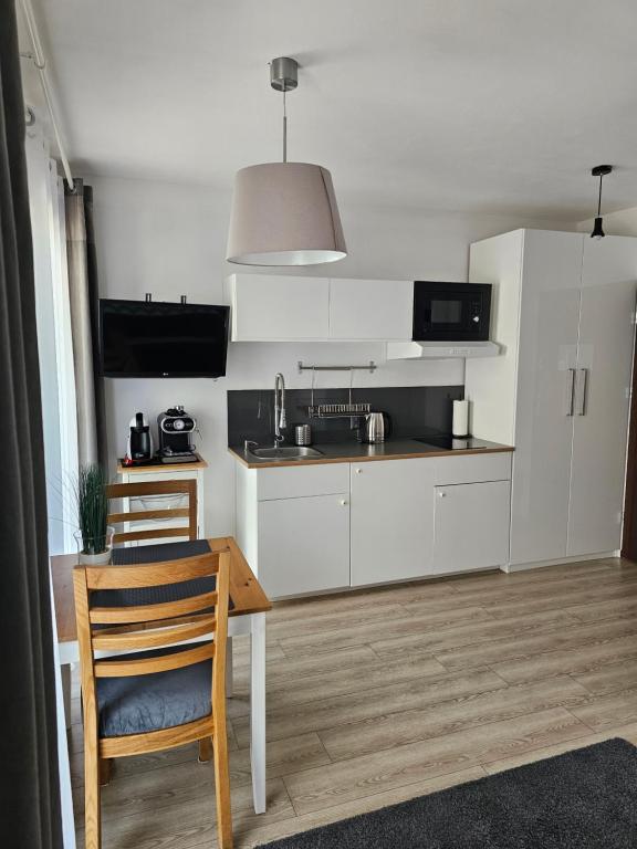 Kuchnia lub aneks kuchenny w obiekcie Dom Przy Plaży