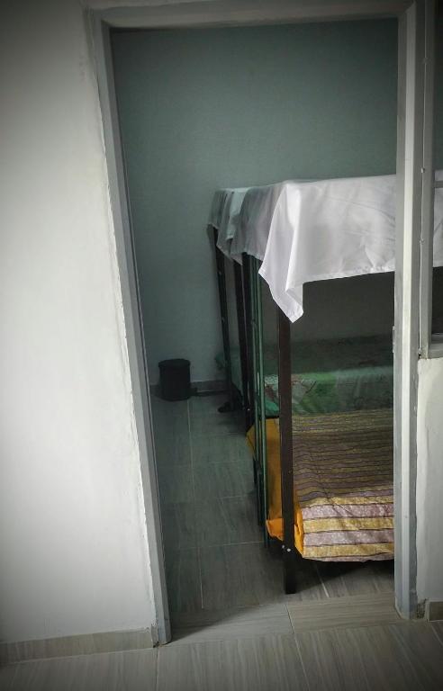 Letto o letti in una camera di Hostal EL TRIUNFO MUKUPETRA