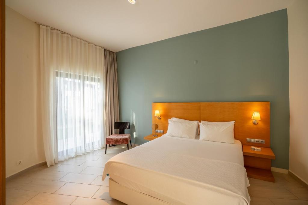 A bed or beds in a room at Med-Inn Hotel
