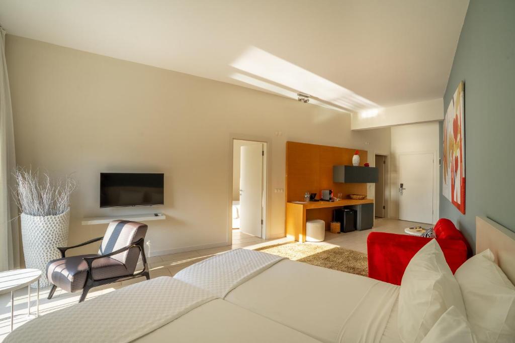 A television and/or entertainment centre at Med-Inn Hotel