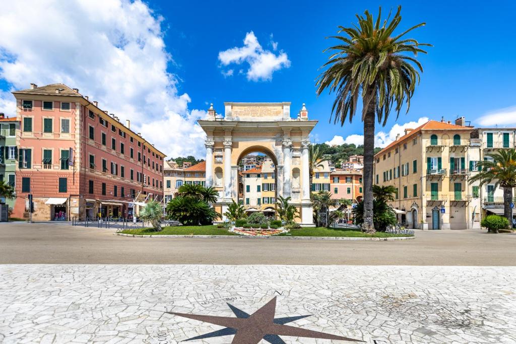 a building with a star in the middle of a street at Hostdomus-Finalmarina apartment in Finale Ligure