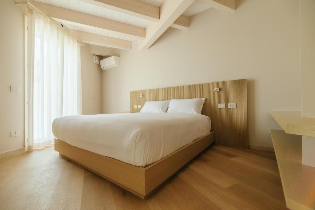 Ένα ή περισσότερα κρεβάτια σε δωμάτιο στο Portonovo Suites