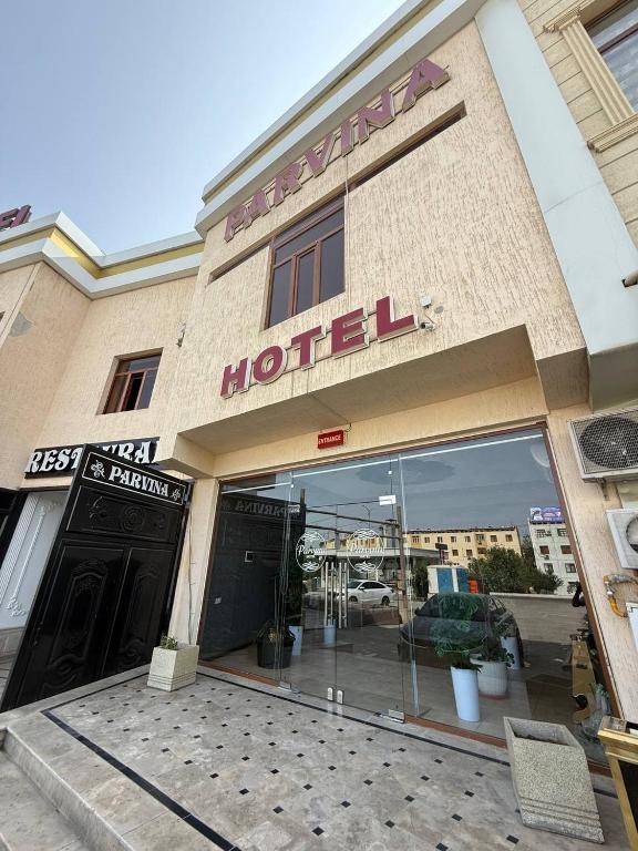 a hotel sign on the front of a building at Parvina hotel and restaurant in Bukhara