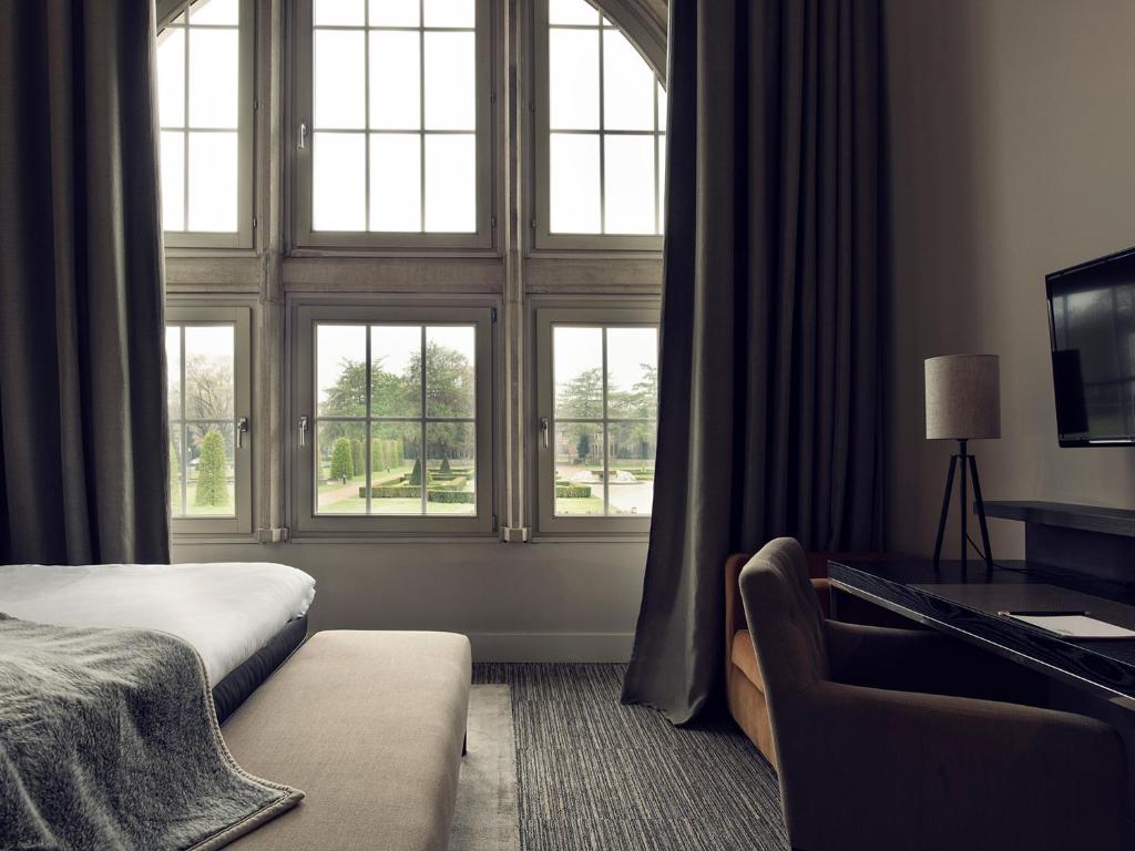 Postel nebo postele na pokoji v ubytování Terhills Hotel