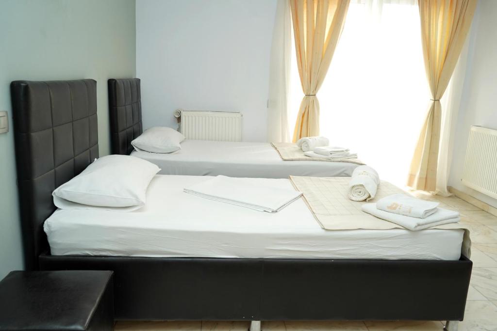 Postel nebo postele na pokoji v ubytování Hotel Bliss