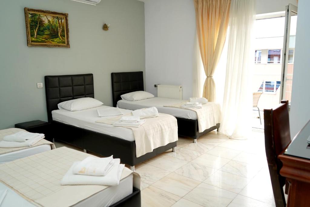Postel nebo postele na pokoji v ubytování Hotel Bliss