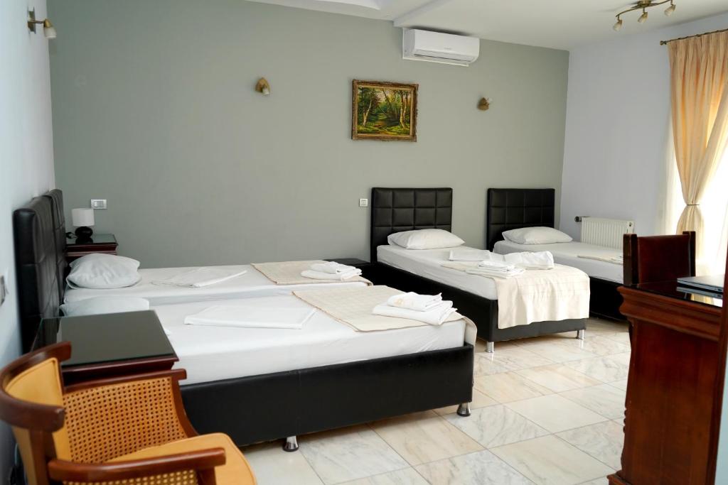 Postel nebo postele na pokoji v ubytování Hotel Bliss