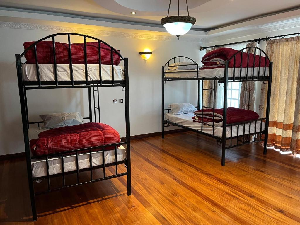 Postel nebo postele na pokoji v ubytování Nairobi Nomad Backpackers Hostel
