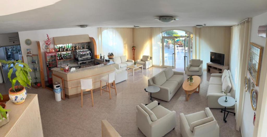 TV a/nebo společenská místnost v ubytování Hotel Maronti
