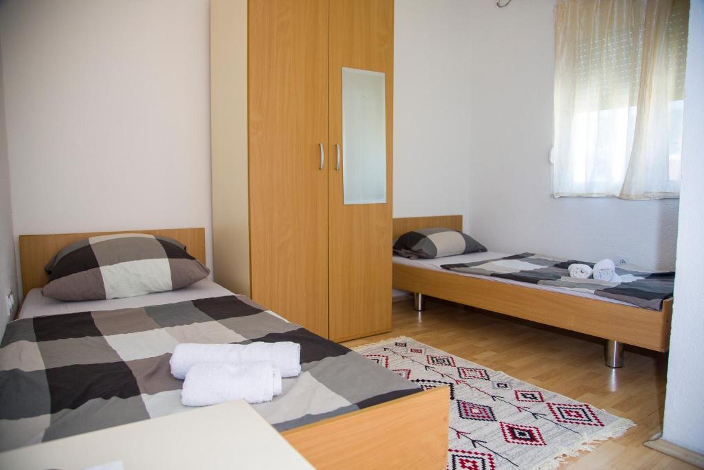 Postel nebo postele na pokoji v ubytování Guesthouse Bajric