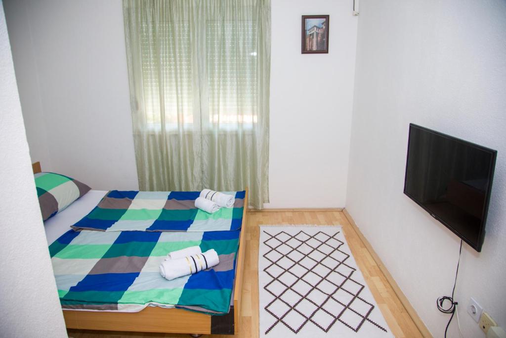 Postel nebo postele na pokoji v ubytování Guesthouse Bajric
