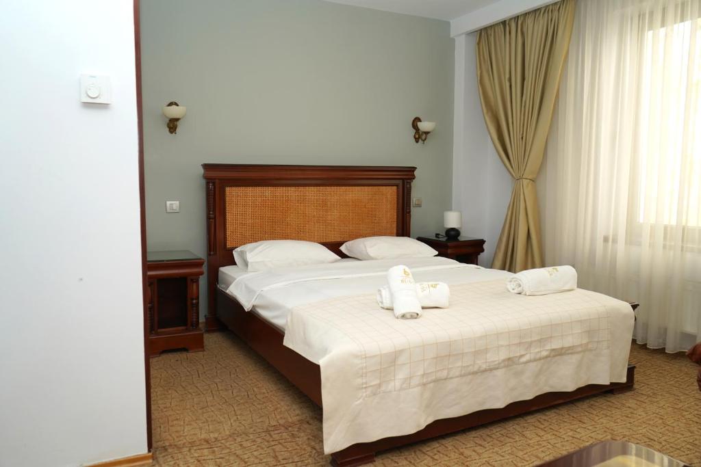Postel nebo postele na pokoji v ubytování Hotel Bliss